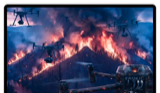 A live disaster-control view showing camera drones surveying a mountain wildfire