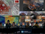 Emergency response control center combining maps, drone feeds, and disaster monitoring