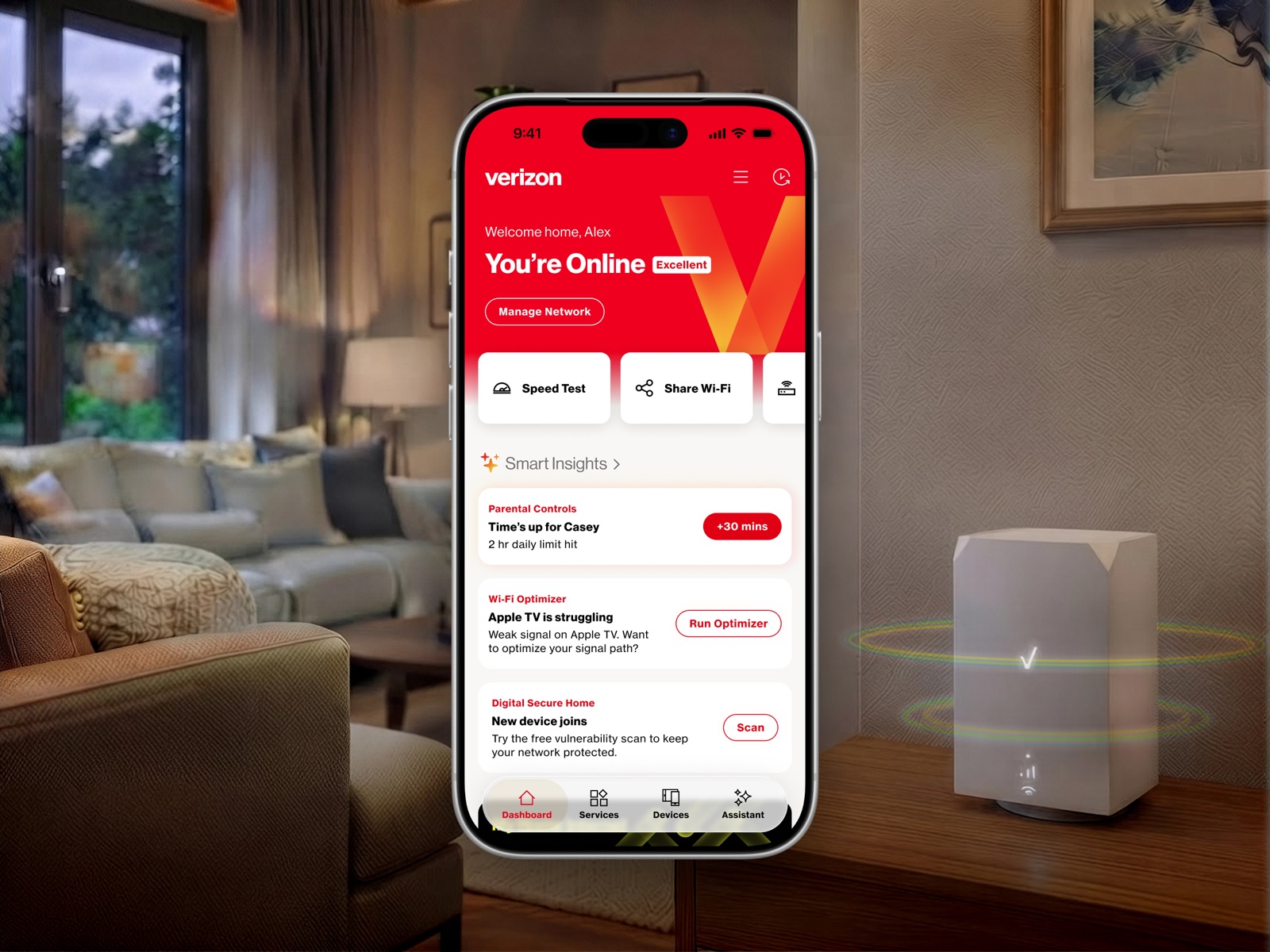 Verizon home-network dashboard displayed on a phone beside a wireless router